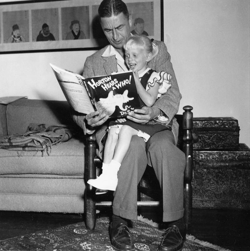 Author and illustrator Theodor Seuss Geisel, known as Dr. Seuss, reads from his book "Horton Hears a Who!" to four-year-old Lucinda Bell at his home in La Jolla, Ca., June 20, 1956 ( AP Photo )