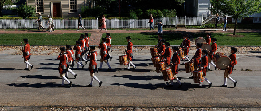 Group of Soldiers marching down a street