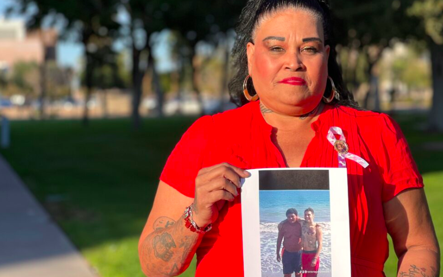 Mother holds photo of her missing child