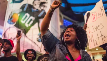 A demonstrator shouts while participating in protests