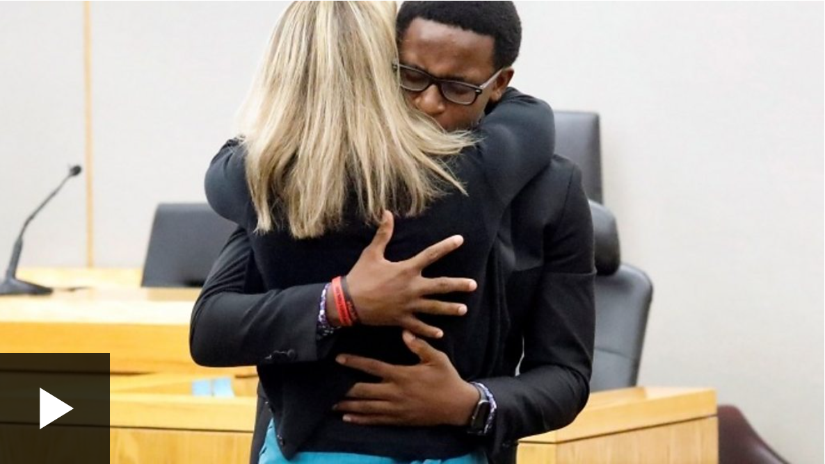 Brandt Jean embraces his brother's killer in court