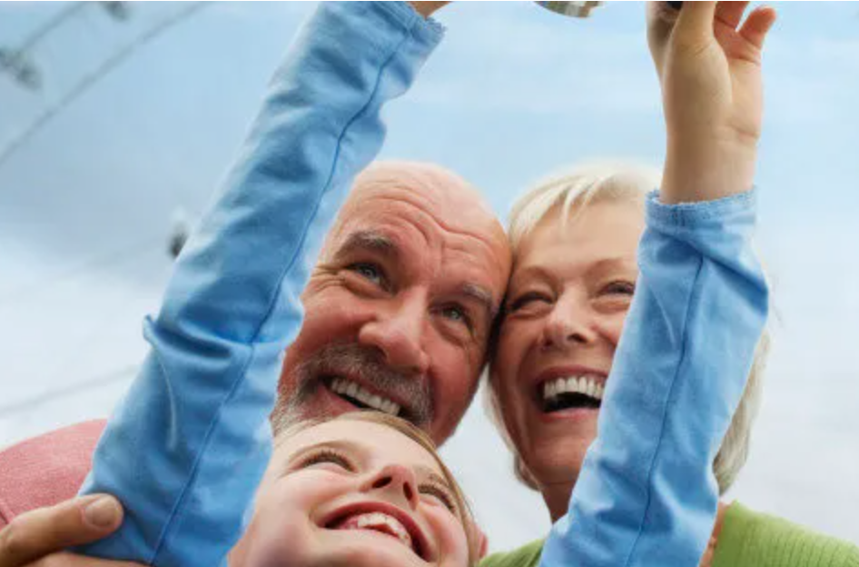 Grandparents and Granddaughter with Digital Camera