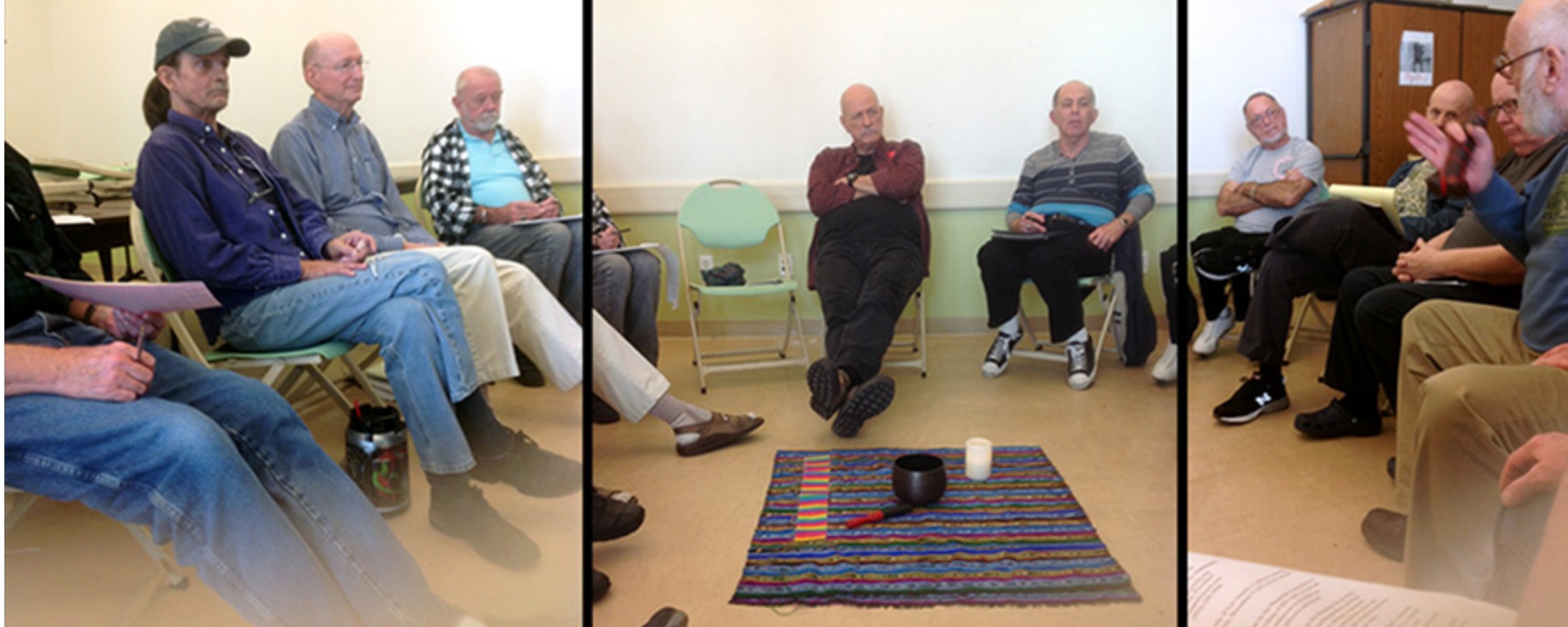 A group of elderly men sit in a circle talking 