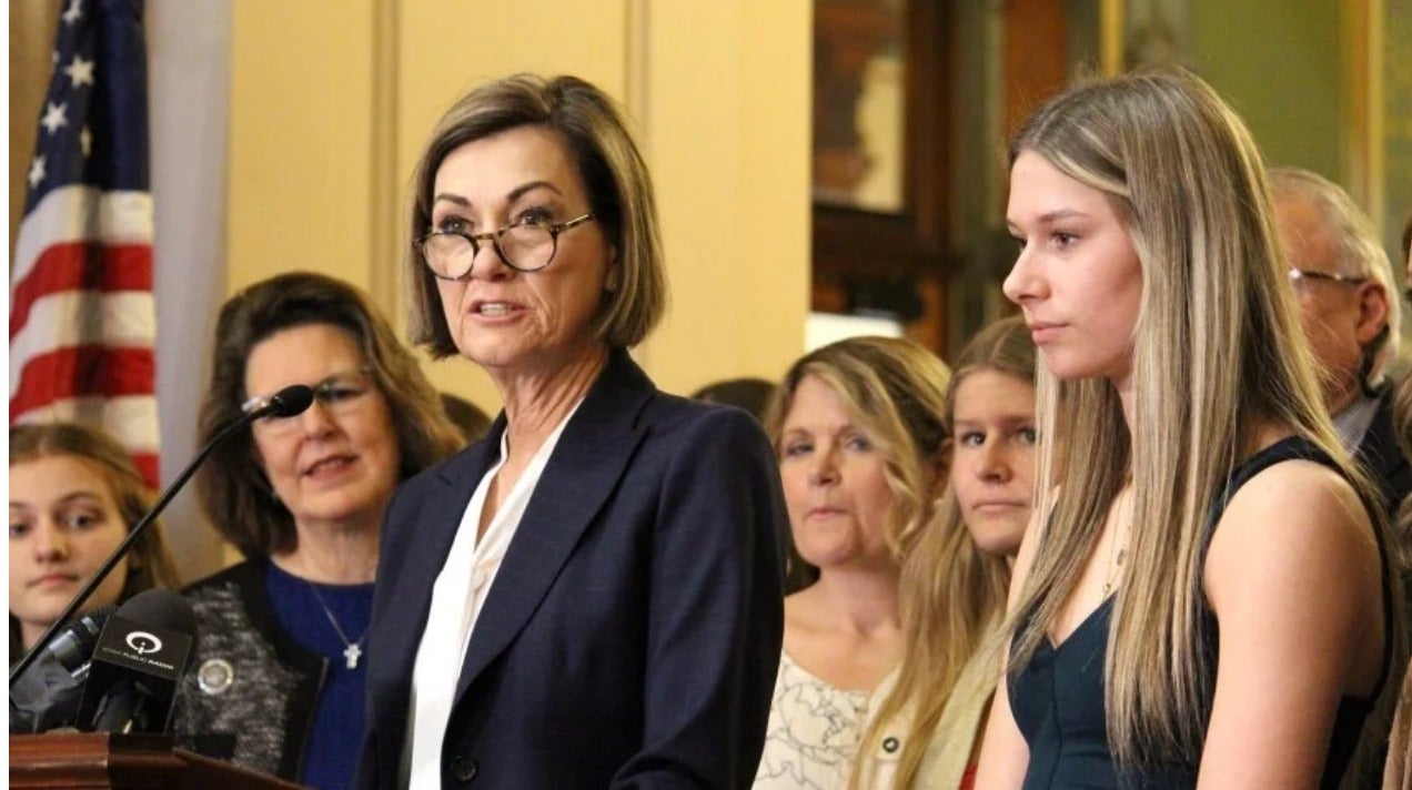 owa Gov. Kim Reynolds speaks before signing a law barring transgender women from female sports