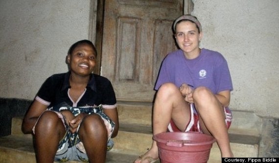 Removing rocks from buckets of beans in Tanzania