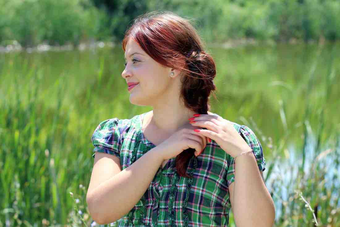 person looking out in field reflectively