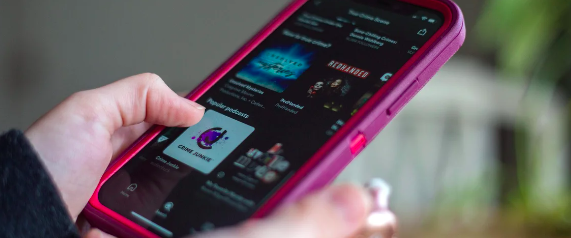 Person scrolling through phone looking at true crime podcasts